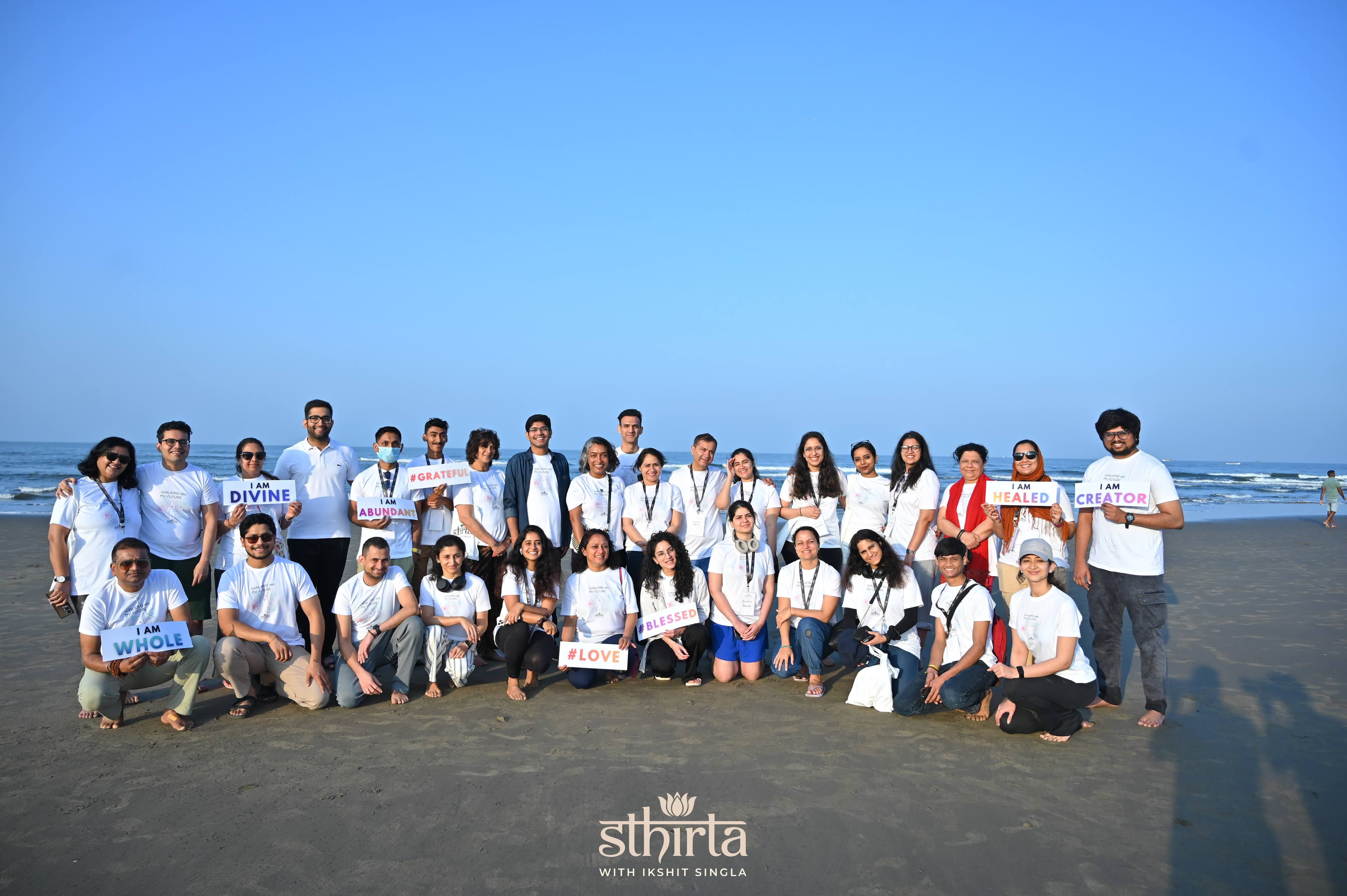 Sthirta retreat group photo on a beach